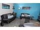 Stylish living room with city skyline art and comfortable seating at 3426 Ireland Dr, Indianapolis, IN 46235