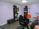 Salon space with product shelving, hairstyling chairs and block wall at 3426 Ireland Dr, Indianapolis, IN 46235
