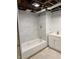 Clean, new bathroom with white vanity, tub, and shower featuring tile surround at 357 N 18Th Ave, Beech Grove, IN 46107