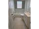 Bathroom with shower-tub combination, tile backsplash, and white vanity at 357 N 18Th Ave, Beech Grove, IN 46107