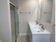 Modern bathroom featuring double vanity, quartz countertop and glass-enclosed shower at 357 N 18Th Ave, Beech Grove, IN 46107