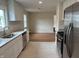 View of updated kitchen with stainless appliances overlooking the open layout at 357 N 18Th Ave, Beech Grove, IN 46107