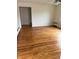 Bright living room showcasing hardwood floors, neutral walls, and a ceiling fan with light fixture at 357 N 18Th Ave, Beech Grove, IN 46107