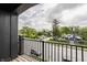 Enjoy a charming balcony view from this home with a black railing overlooking a tranquil street at 401 Jersey St, Westfield, IN 46074