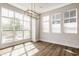 Bright dining area featuring large windows and a modern chandelier at 401 Jersey St, Westfield, IN 46074