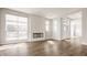Spacious living room with wood flooring, modern fireplace, and lots of natural light at 401 Jersey St, Westfield, IN 46074
