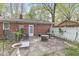 Back patio with brick home, white fencing, and outdoor furniture, great for entertaining at 4050 Westover Dr, Indianapolis, IN 46268