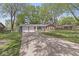 Attractive single-story brick home with attached two-car garage and a large driveway at 4050 Westover Dr, Indianapolis, IN 46268