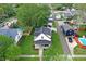 Aerial view of the house showcasing its well-manicured lawn, street appeal and detached garage at 410 E North St, Greenfield, IN 46140