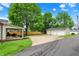 View of the backyard and detached two-car garage, complete with a covered patio area and ample parking space at 410 E North St, Greenfield, IN 46140