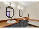 Elegant bathroom with double vanity, wood counters, and stylish lighting at 410 E North St, Greenfield, IN 46140