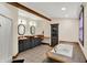 Spacious bathroom featuring a soaking tub, double sinks, and modern fixtures at 410 E North St, Greenfield, IN 46140