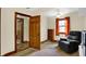 Bedroom with reading chair, built in shelves and view to other rooms at 410 E North St, Greenfield, IN 46140