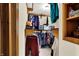 Walk-in closet featuring ample storage shelves and organized clothing at 410 E North St, Greenfield, IN 46140