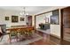 Charming dining room featuring a unique table with seating for six and views into kitchen at 410 E North St, Greenfield, IN 46140