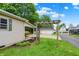Long driveway leading to garage with landscaped yard at 410 E North St, Greenfield, IN 46140