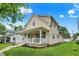 Attractive two-story home with a welcoming front porch and manicured lawn at 410 E North St, Greenfield, IN 46140