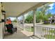 Cozy front porch with seating, offering a relaxing outdoor space with neighborhood views at 410 E North St, Greenfield, IN 46140
