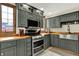 The kitchen with stainless steel appliances, wooden countertops and dark cabinets at 410 E North St, Greenfield, IN 46140