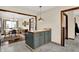 This kitchen features an island with seating and views of the dining room at 410 E North St, Greenfield, IN 46140