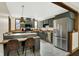 Kitchen featuring stainless steel appliances, modern cabinets, breakfast bar, and stylish design at 410 E North St, Greenfield, IN 46140