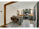 Updated kitchen features stainless appliances, breakfast bar, stylish green cabinets, and butcher block countertops at 410 E North St, Greenfield, IN 46140