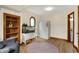 Bright, cozy living area with hardwood floors, built-in shelves, and a lovely round rug at 410 E North St, Greenfield, IN 46140