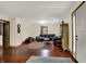 Inviting living room with hardwood floors, large sectional sofa, and natural light from the windows at 410 E North St, Greenfield, IN 46140