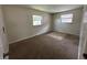 Bedroom featuring neutral walls and carpet, with two windows offering natural light at 4109 East 21St St, Indianapolis, IN 46218