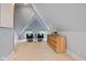 Inviting attic nook with seating, a dresser, and dormer windows at 419 N College Ave, Indianapolis, IN 46202