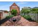 Brick patio featuring outdoor seating and a lush garden at 419 N College Ave, Indianapolis, IN 46202