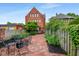 Private backyard featuring a brick patio and seating, perfect for outdoor entertaining and relaxation at 419 N College Ave, Indianapolis, IN 46202