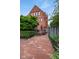 Brick patio and wood deck with partial view of the brick home at 419 N College Ave, Indianapolis, IN 46202