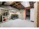 Spacious basement laundry area with washer, dryer, utility sink, shelving, and updated mechanics at 419 N College Ave, Indianapolis, IN 46202