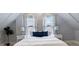 Cozy bedroom featuring a comfortable bed, soft lighting, and stylish decor at 419 N College Ave, Indianapolis, IN 46202