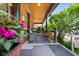 Charming front porch with outdoor seating and a view of the 'For Sale' sign at 419 N College Ave, Indianapolis, IN 46202