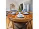 Eat-in kitchen with stainless steel appliances, gray cabinets, and a round table set for four at 419 N College Ave, Indianapolis, IN 46202