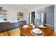 Eat-in kitchen includes stainless steel appliances, gray cabinets, subway tile, and butcher block shelves at 419 N College Ave, Indianapolis, IN 46202