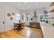 Bright kitchen features stainless steel appliances, subway tile backsplash, and a dining table for four at 419 N College Ave, Indianapolis, IN 46202