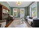 Inviting living room with a fireplace, natural light, hardwood floors, and neutral color scheme at 419 N College Ave, Indianapolis, IN 46202
