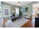 Elegant living room with hardwood floors, neutral decor, and an artful arrangement at 419 N College Ave, Indianapolis, IN 46202