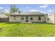 View of the home's backyard featuring grass, a patio, and access to a shed at 4195 Knollwood Ct, Franklin, IN 46131