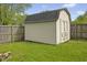 Exterior view of the shed in the backyard behind a wooden fence at 4195 Knollwood Ct, Franklin, IN 46131