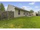 Exterior view of the home's backyard featuring grass, a shed, and a wood fence at 4195 Knollwood Ct, Franklin, IN 46131