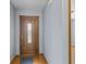 Bright foyer featuring wood-look flooring and a decorative front door with window, providing a warm welcome at 4195 Knollwood Ct, Franklin, IN 46131