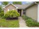 Inviting front entrance with a manicured garden bed, decorative tree, and walkway leading to the front door at 4195 Knollwood Ct, Franklin, IN 46131