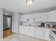 Well-lit kitchen with white cabinets and appliances at 4195 Knollwood Ct, Franklin, IN 46131