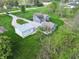 Aerial view of house with a large manicured lawn and outbuildings, showcasing the property's spaciousness at 4284 E County Road 100 S, Avon, IN 46123