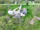 Overhead aerial view showcasing the house, outbuildings, and outdoor patio area on a well-maintained lot at 4284 E County Road 100 S, Avon, IN 46123