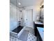 Modern bathroom features a walk-in shower with glass door and a dual-sink vanity at 4284 E County Road 100 S, Avon, IN 46123